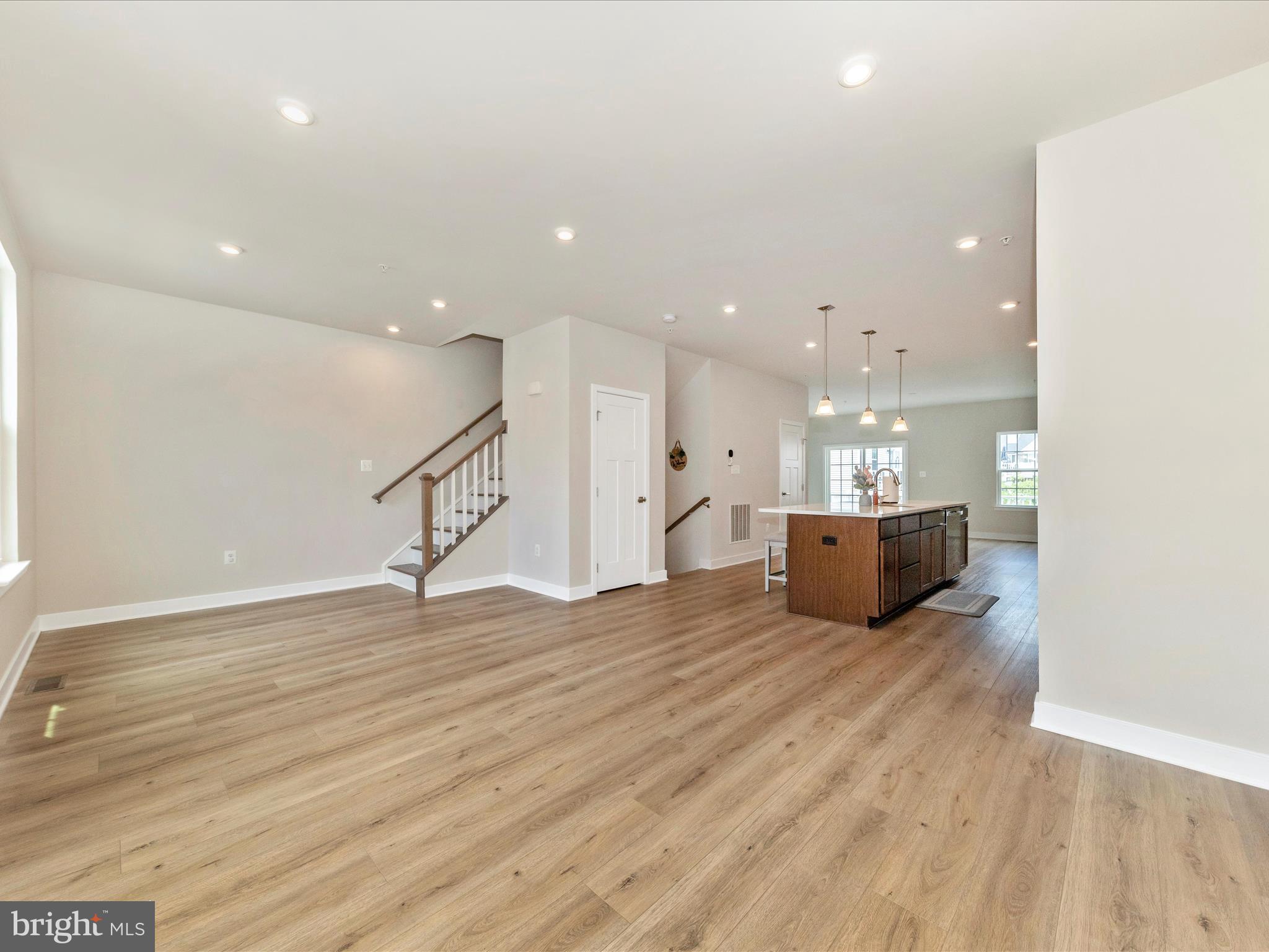 1721 Atlas Drive Frederick, MD 21702 - Photo 16 of 52 a view of an empty room with wooden floor