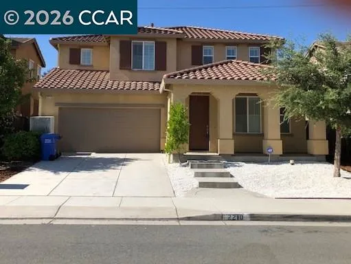 a view of building with garage