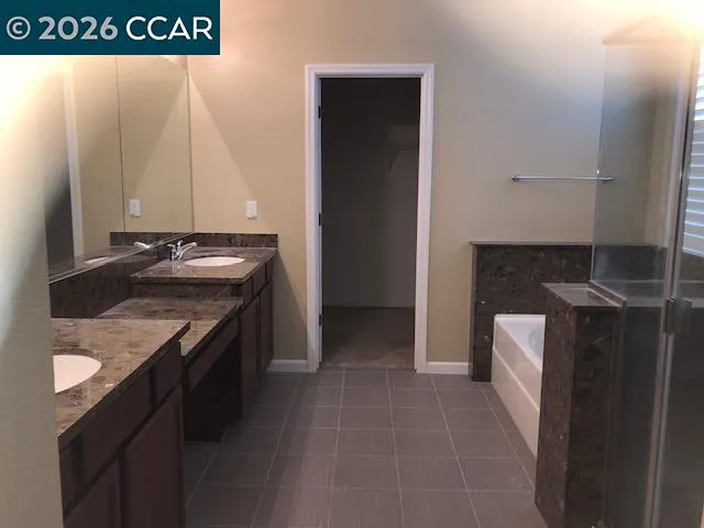 a kitchen with a sink and a refrigerator