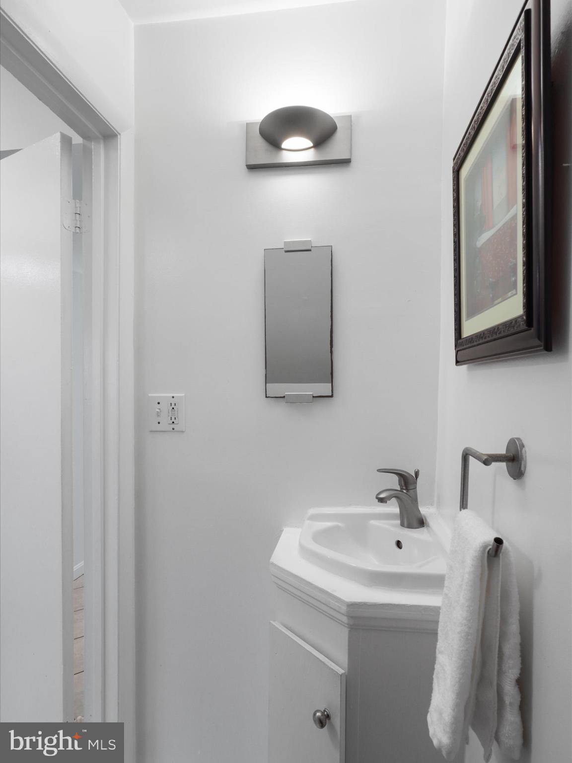 246 Stevenson Square Alexandria, VA 22304 - Photo 14 of 31 a bathroom with a sink and a mirror