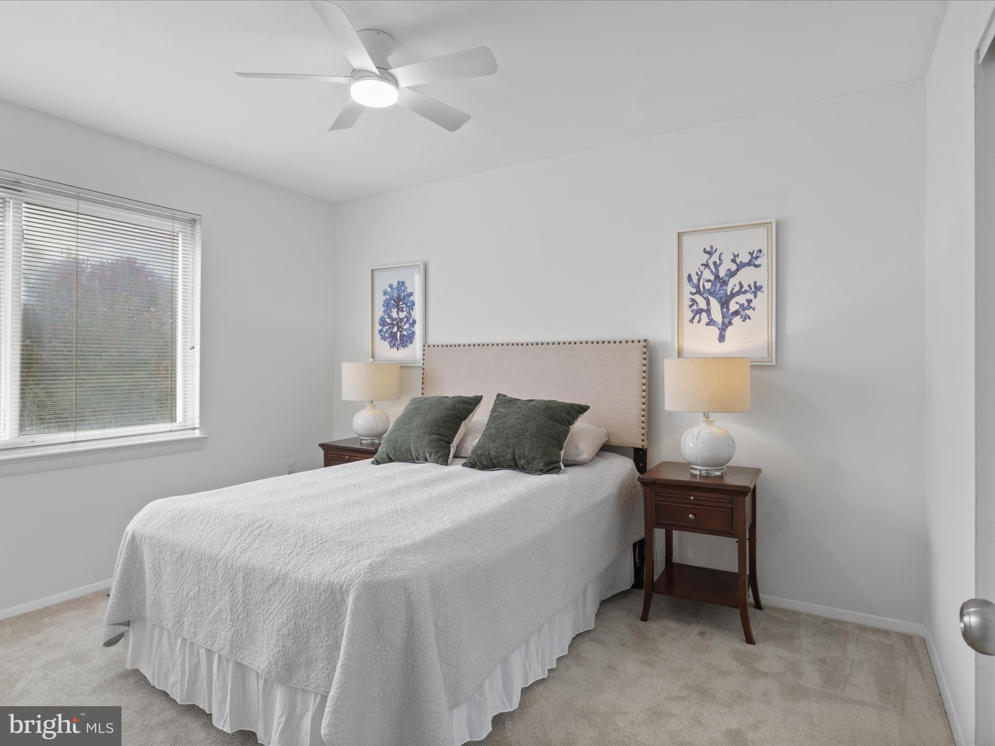 246 Stevenson Square Alexandria, VA 22304 - Photo 16 of 31 a bedroom with a bed and a lamp on dresser