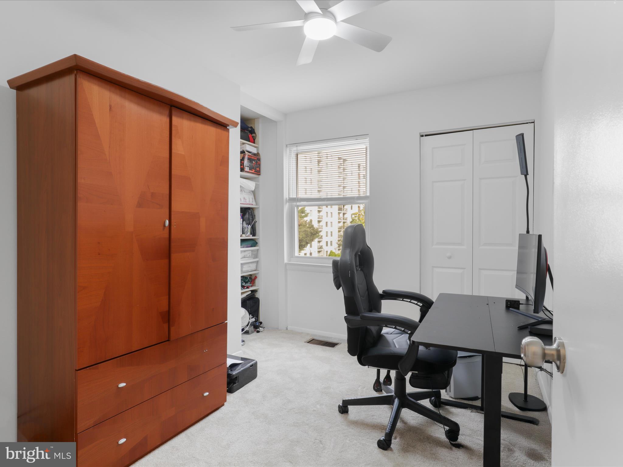 246 Stevenson Square Alexandria, VA 22304 - Photo 18 of 31 a view of a workspace with furniture and a window