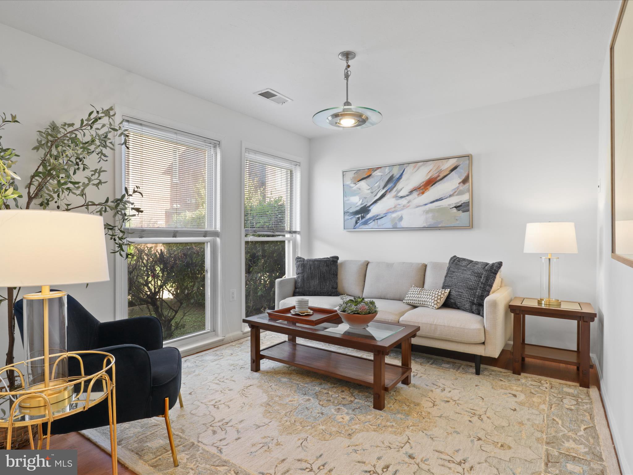 246 Stevenson Square Alexandria, VA 22304 - Photo 4 of 31 a living room with furniture and a lamp