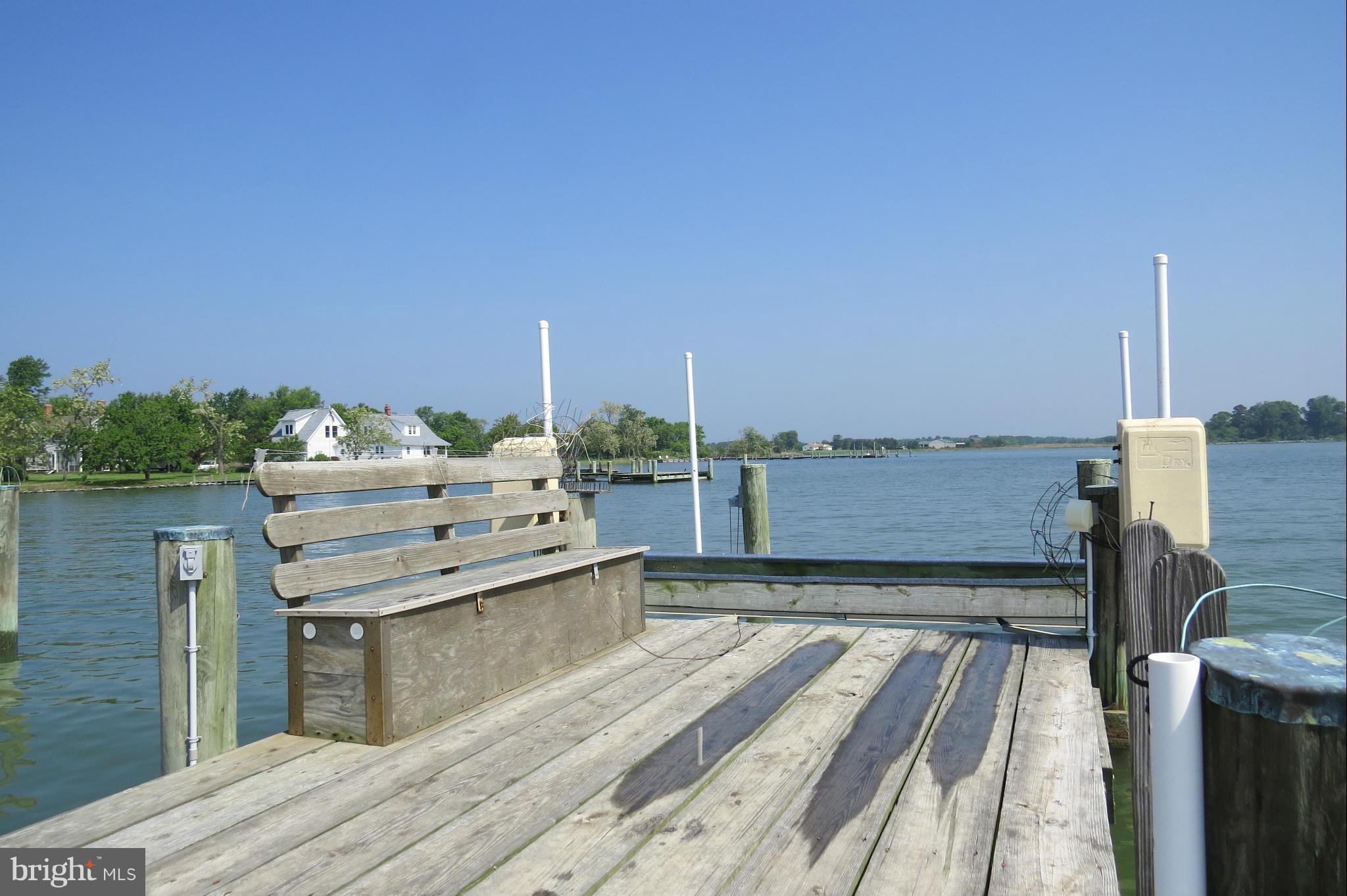4883 Fairbank Road Tilghman, MD 21671 - Photo 22 of 28 Dock with bench and boat lift