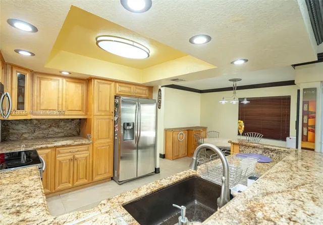 a view of wooden door and chair in the room