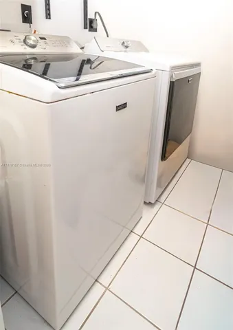 a spacious bathroom with a double vanity sink and a large mirror