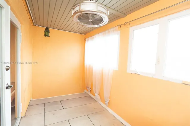 a view of living room with furniture and floor to ceiling window