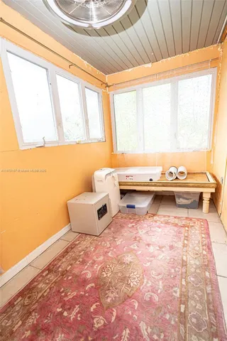 a view of a patio with a table and chairs