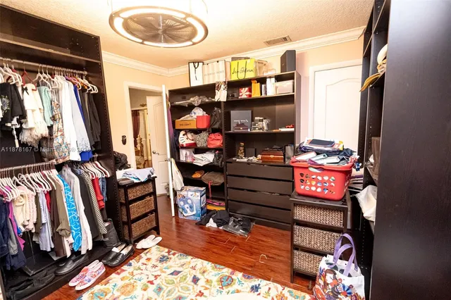 an aerial view of residential houses with outdoor space and street view