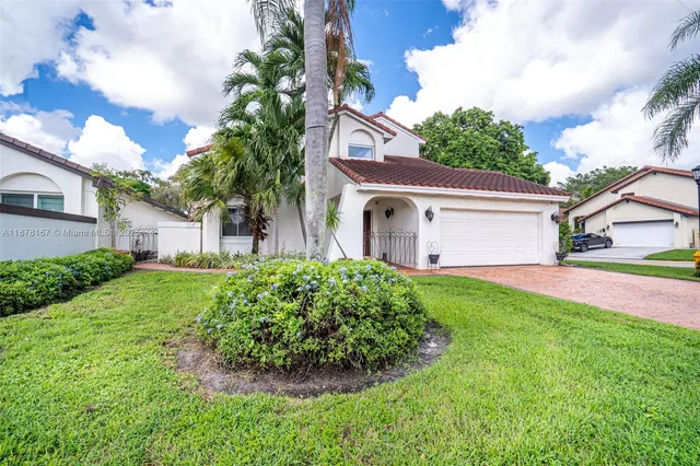 a view of a livingroom with furniture and a floor to ceiling window