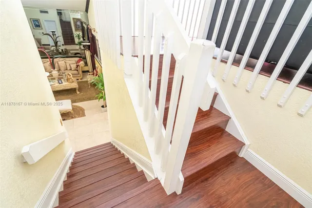 a spacious bathroom with a granite countertop sink and a mirror