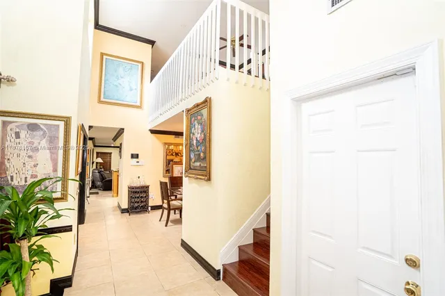 a kitchen with granite countertop a sink stainless steel appliances and counter space