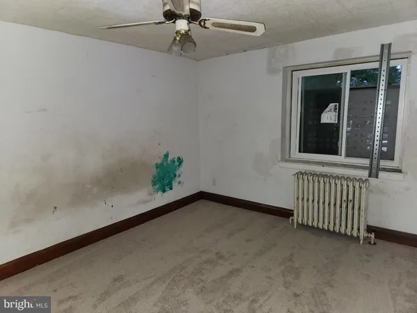 wooden floor in a hall with a window