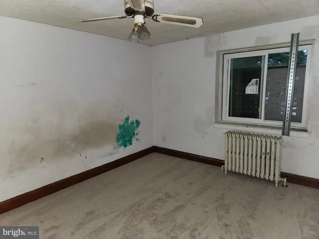 wooden floor in a hall with a window