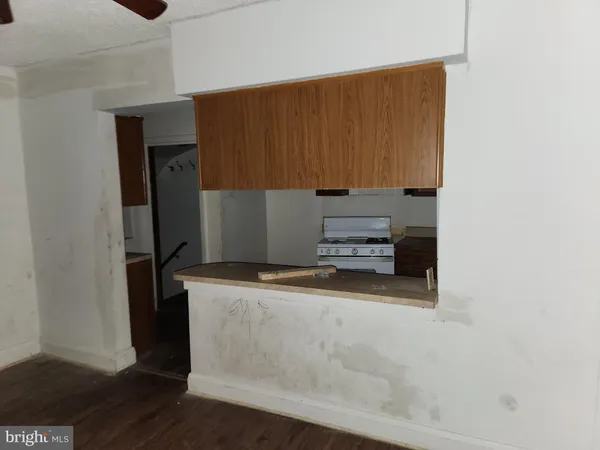 a kitchen with a stove and a refrigerator