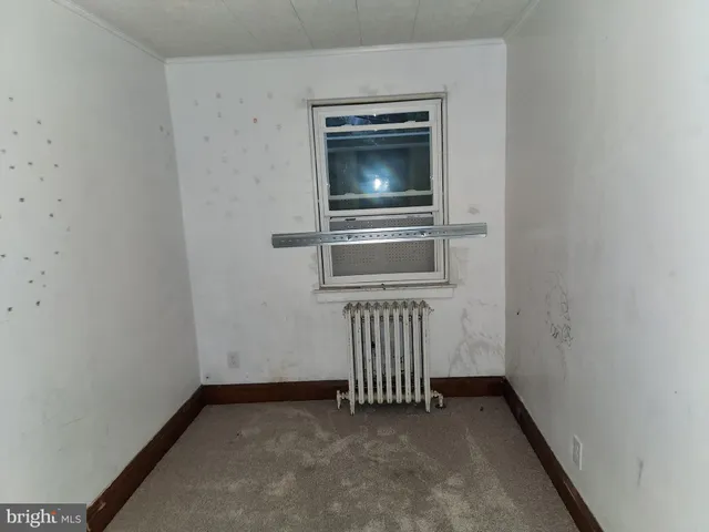 a view of a hallway with a washer and dryer
