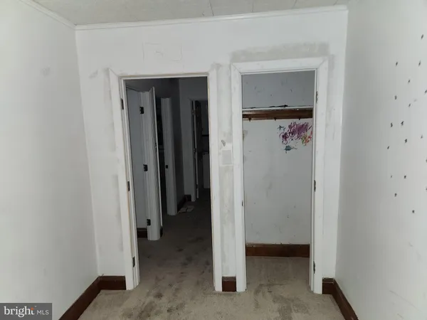a view of a hallway with closet