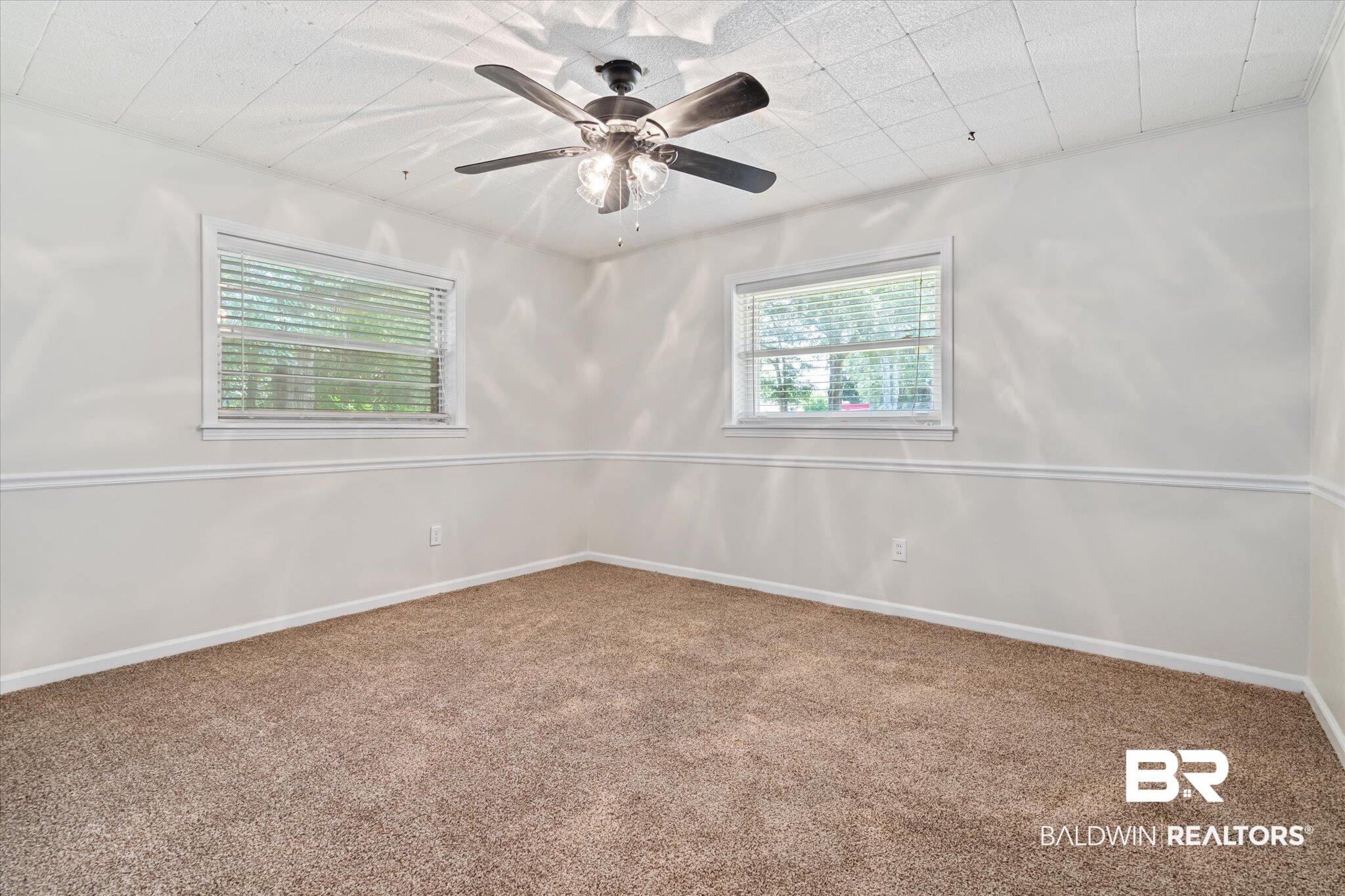 3325 Lacoste Road Mobile, AL 36618 - Photo 11 of 35 Carpeted spare room with ceiling fan