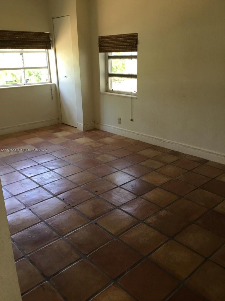 8927 Hawthorne Avenue Surfside, FL 33154 - Photo 14 of 40 a view of empty room with windows