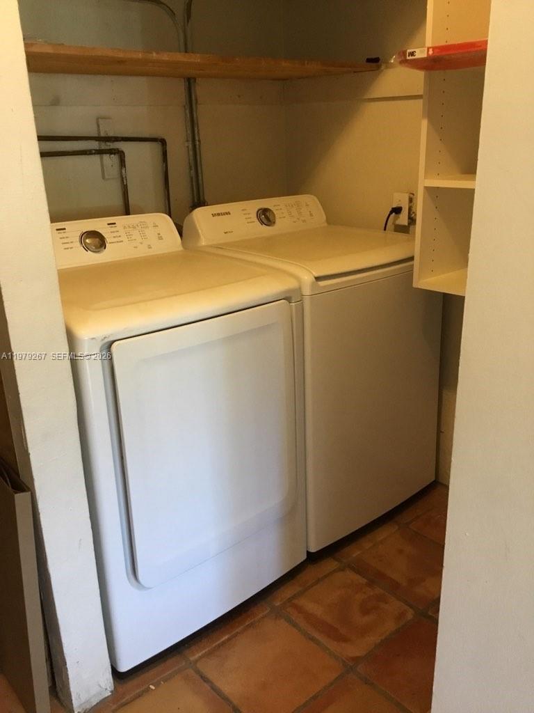 8927 Hawthorne Avenue Surfside, FL 33154 - Photo 16 of 40 a utility room with dryer and washer