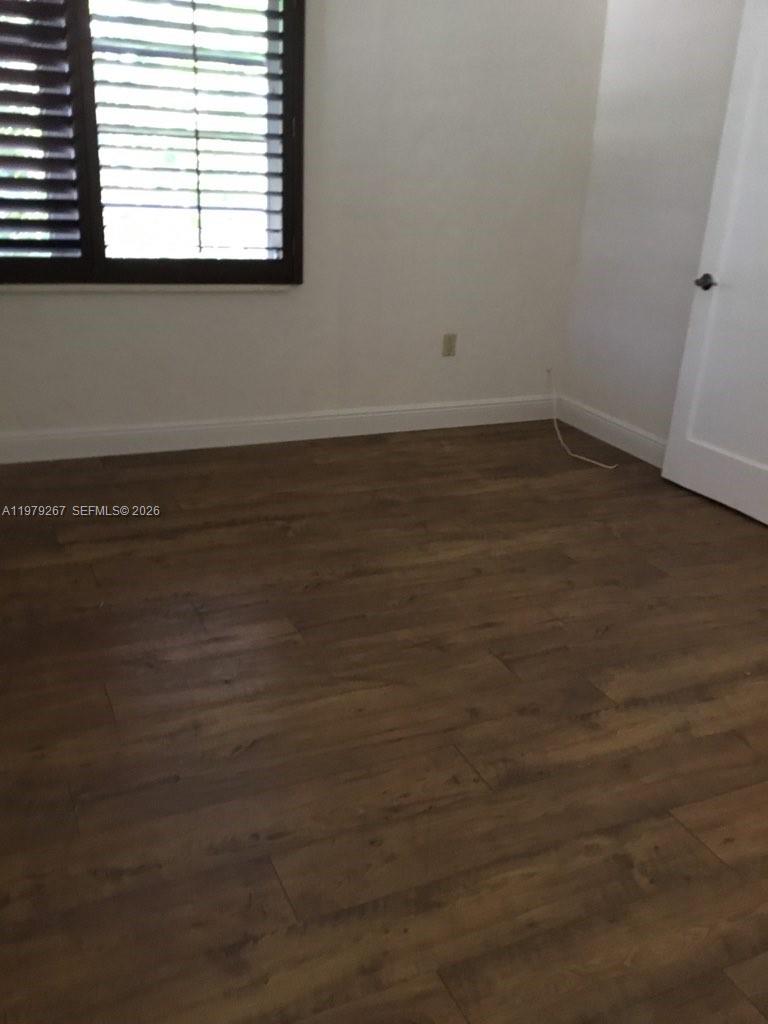 8927 Hawthorne Avenue Surfside, FL 33154 - Photo 27 of 40 an empty room with a window
