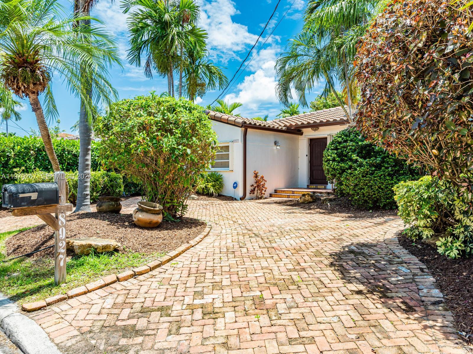 8927 Hawthorne Avenue Surfside, FL 33154 - Photo 4 of 40 a backyard of a house with seating space
