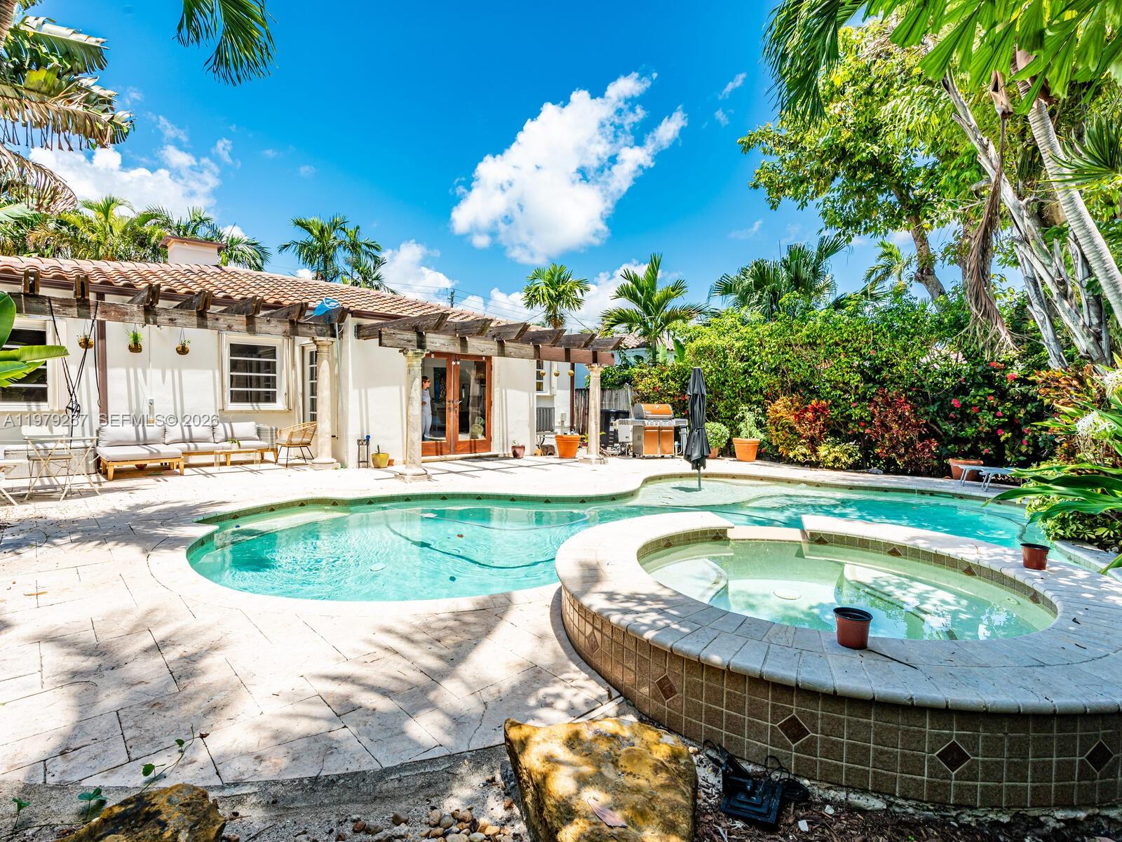8927 Hawthorne Avenue Surfside, FL 33154 - Photo 8 of 40 a view of swimming pool with outdoor seating