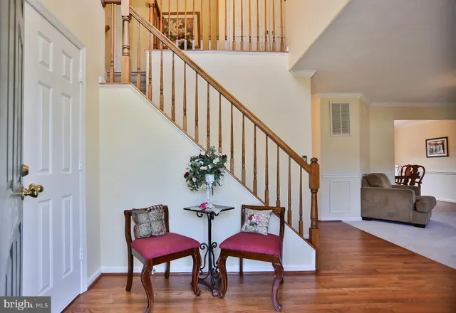 a view of a hallway with couches and pool view