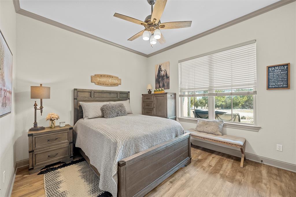 18503 Wortham Bend Road China Spring, TX 76633 - Photo 15 of 40 a bedroom with a bed and a window