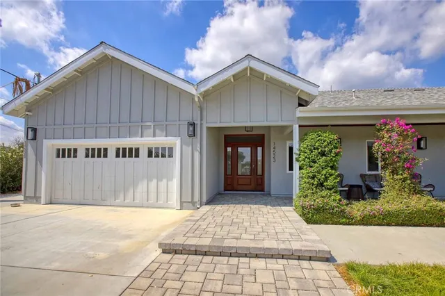 a front view of a house with a garage