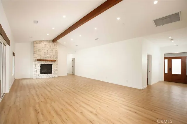 a kitchen with granite countertop a sink stainless steel appliances and cabinets