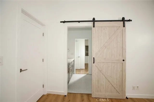 a view of house with backyard outdoor seating and covered with trees