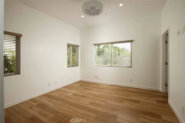 a view of a house with backyard sitting area and garden