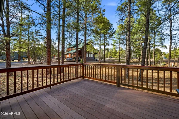 a bedroom with a bed dresser and a window