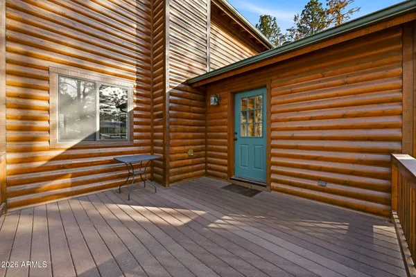 a bed room with a bed and a chandelier