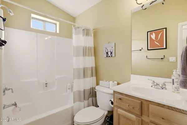 a bedroom with furniture and a window