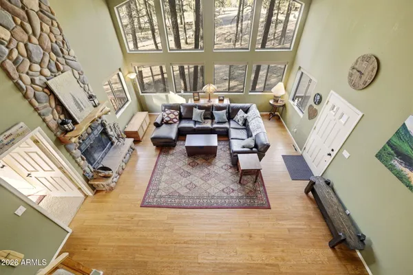 a living room with a couch and a rug