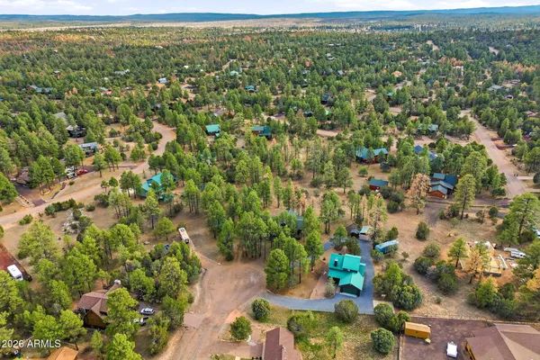a view of a patio with a table and chairs