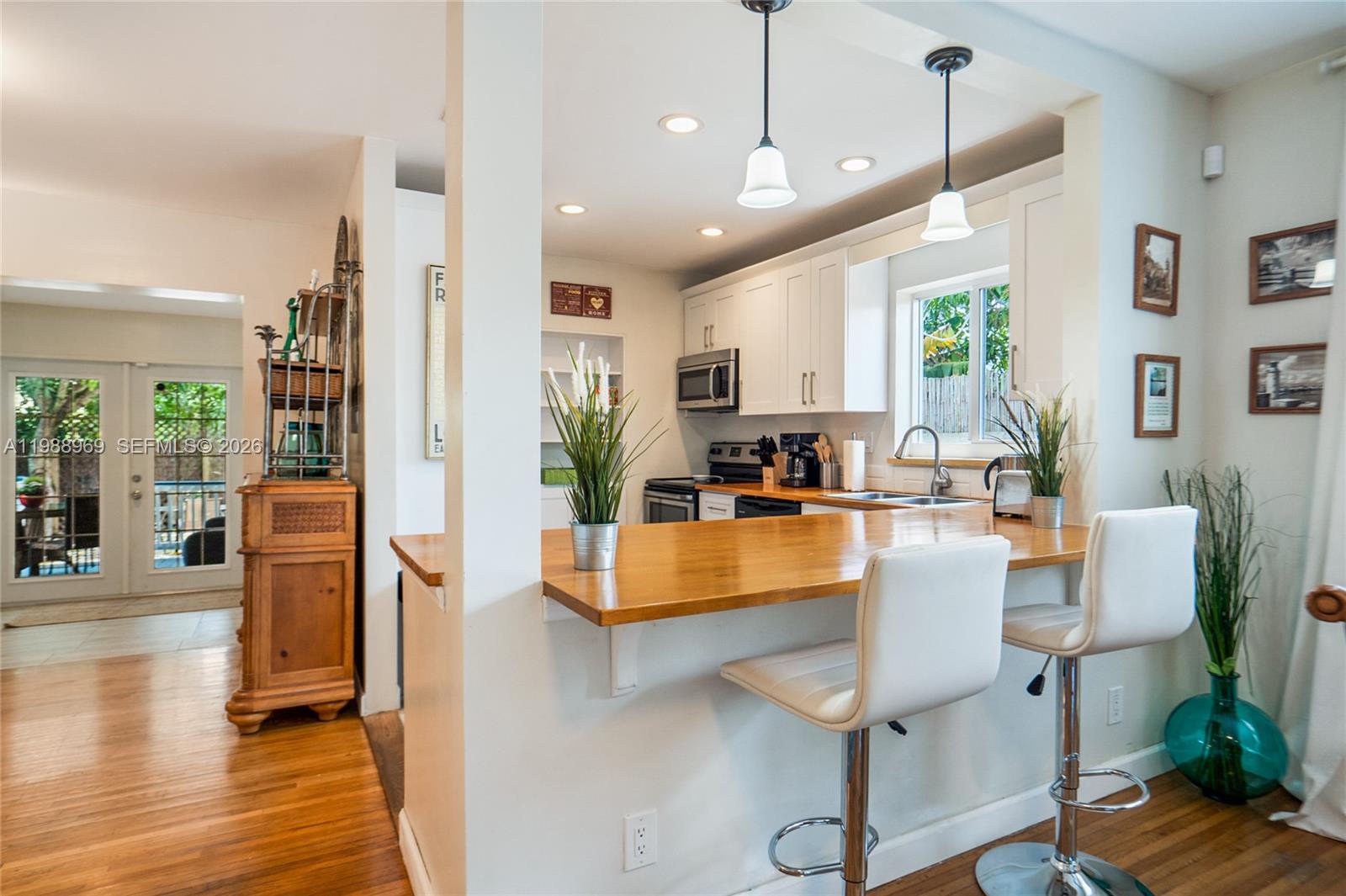 113 Southwest 2nd Street Hallandale Beach, FL 33009 - Photo 12 of 50 a living room with fireplace furniture and a wooden floor