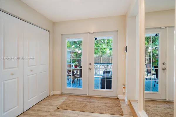 a bedroom with a bed and a mirror