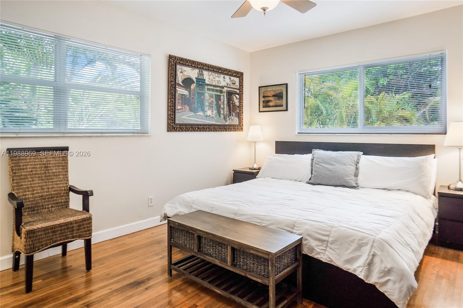 113 Southwest 2nd Street Hallandale Beach, FL 33009 - Photo 17 of 50 a bedroom with a bed and a chair