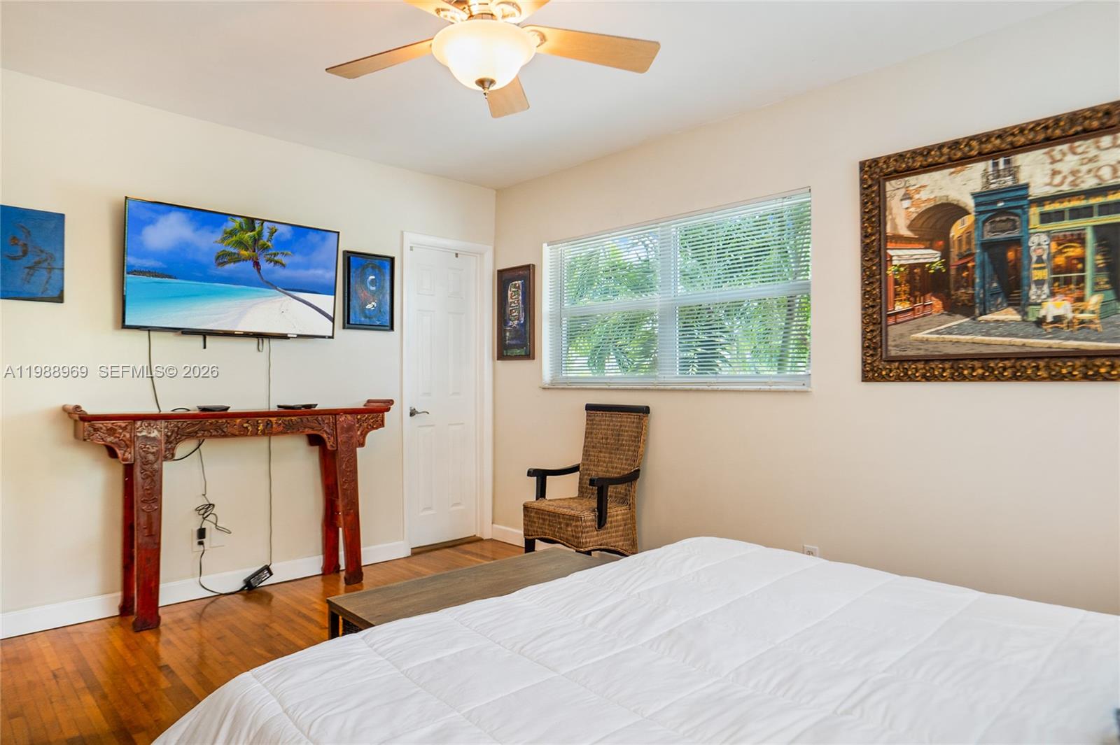 113 Southwest 2nd Street Hallandale Beach, FL 33009 - Photo 19 of 50 a bedroom with a bed and a painting on the wall