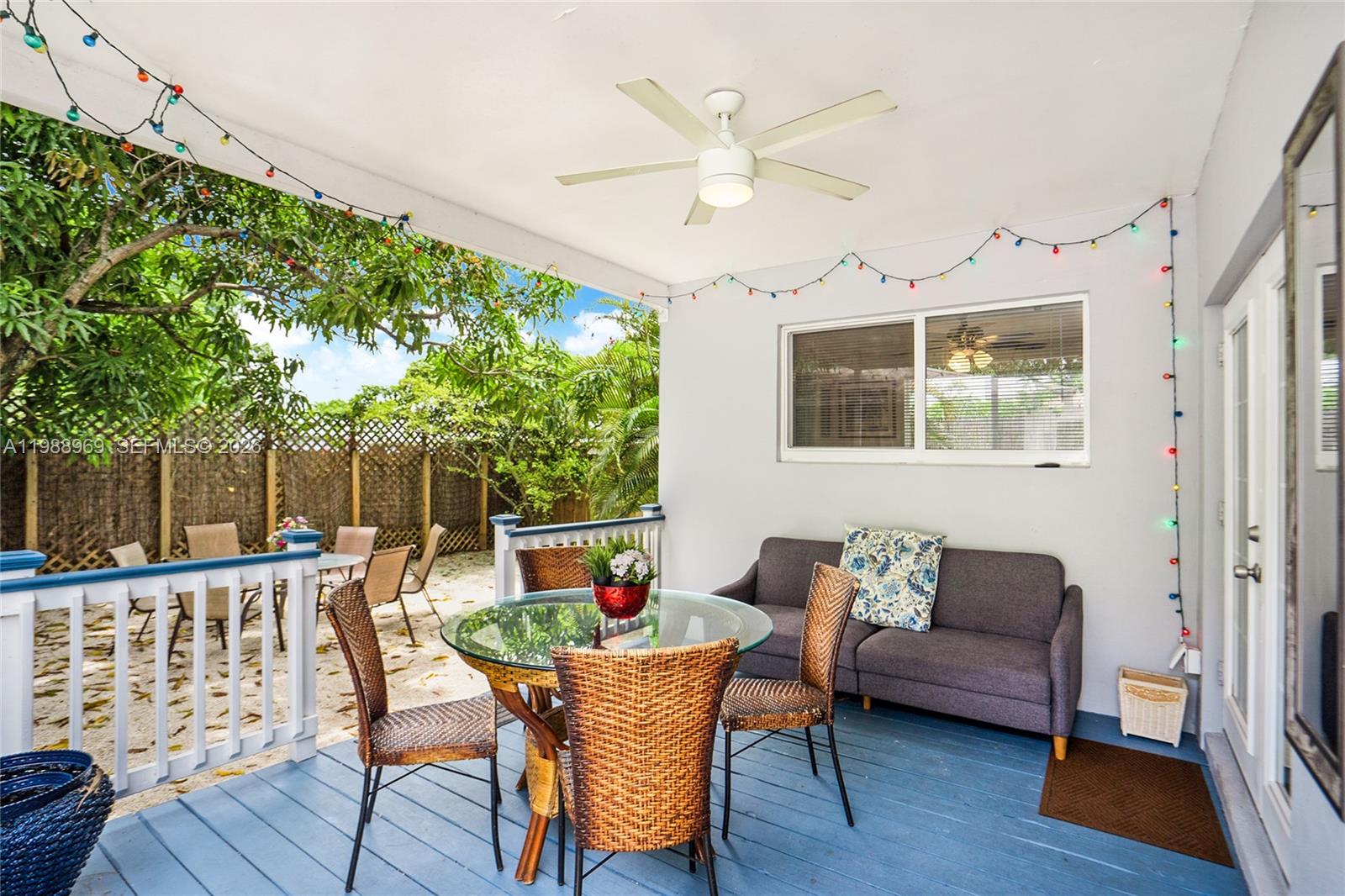 113 Southwest 2nd Street Hallandale Beach, FL 33009 - Photo 23 of 50 a outdoor living space with furniture and wooden floor
