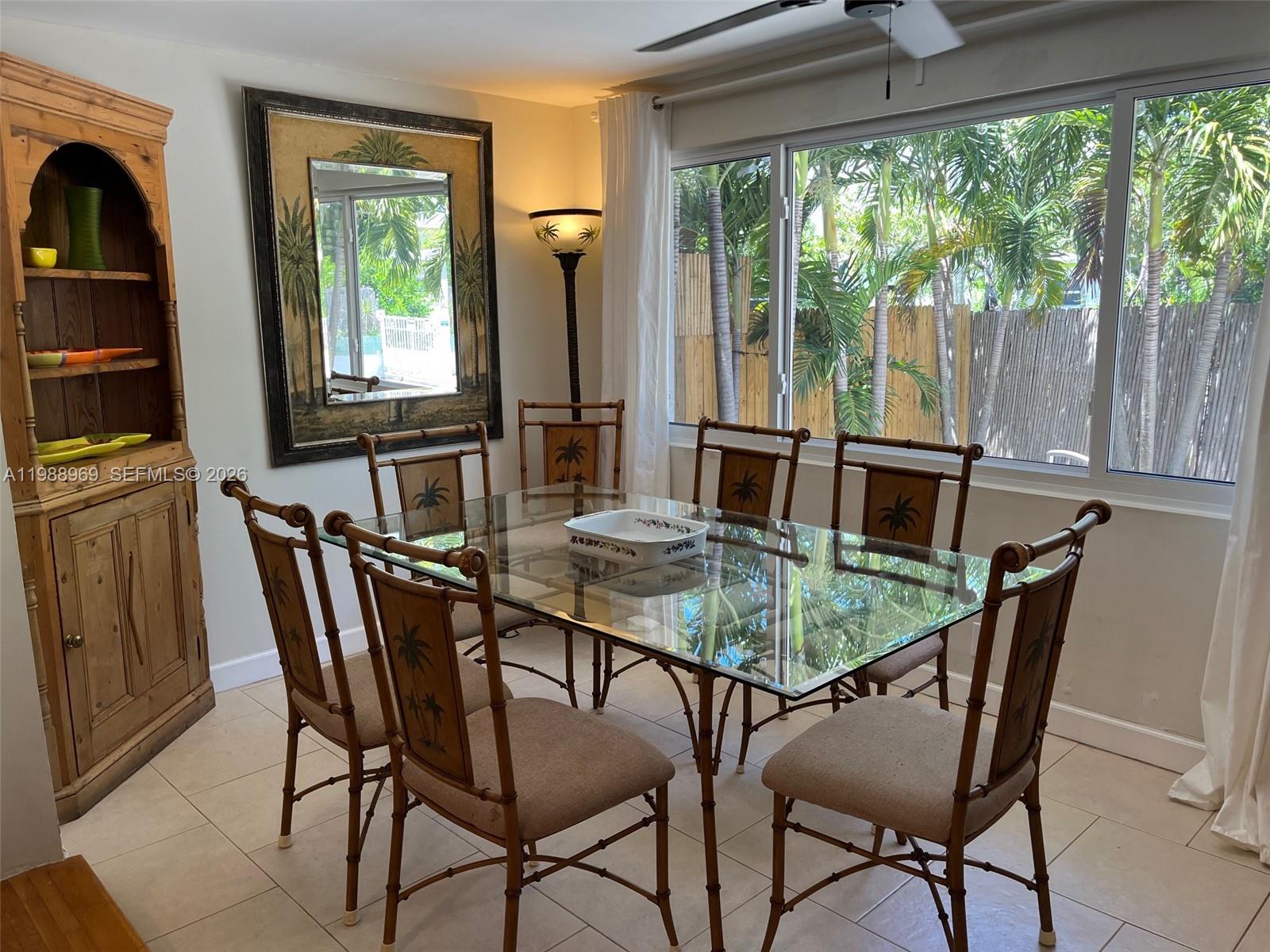 113 Southwest 2nd Street Hallandale Beach, FL 33009 - Photo 29 of 50 a dining room with furniture and window