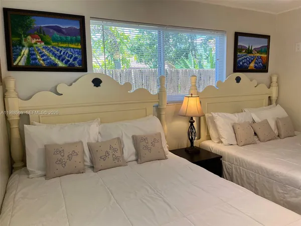 a dining room with furniture window and wooden floor