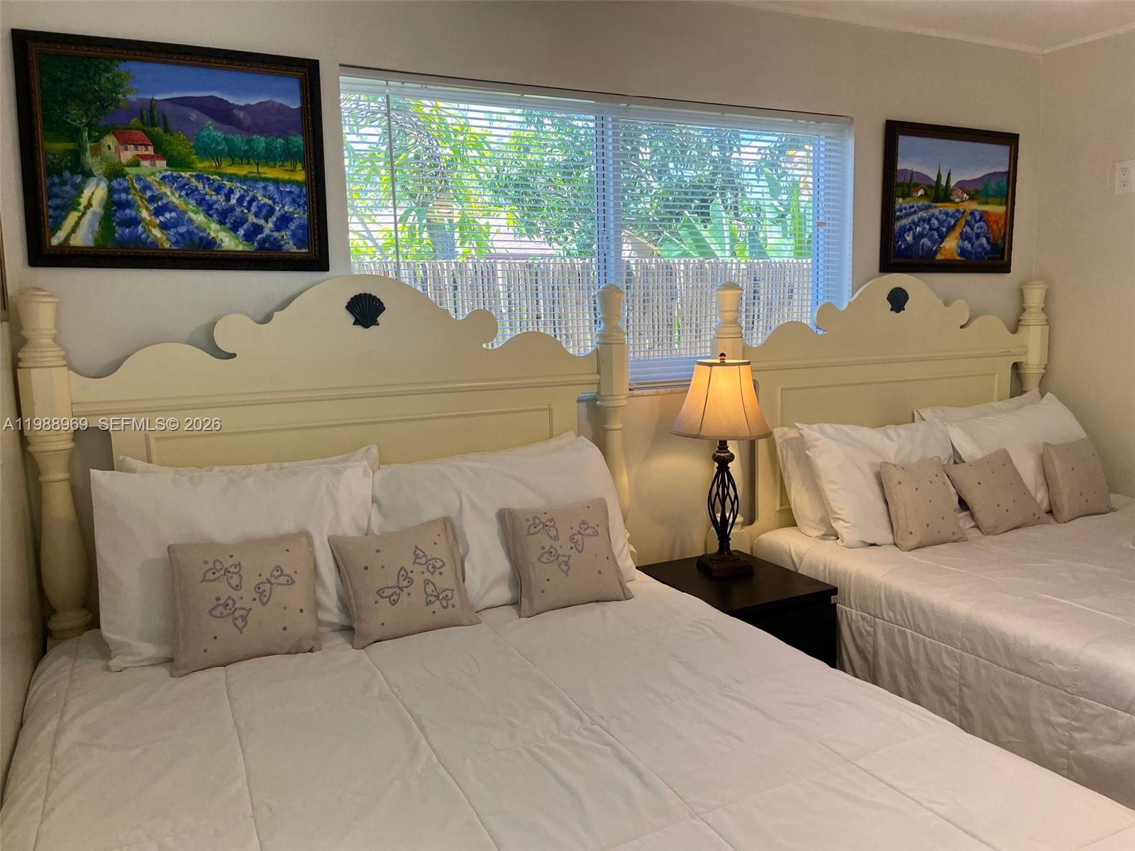 113 Southwest 2nd Street Hallandale Beach, FL 33009 - Photo 31 of 50 a picture of a couch in a bedroom