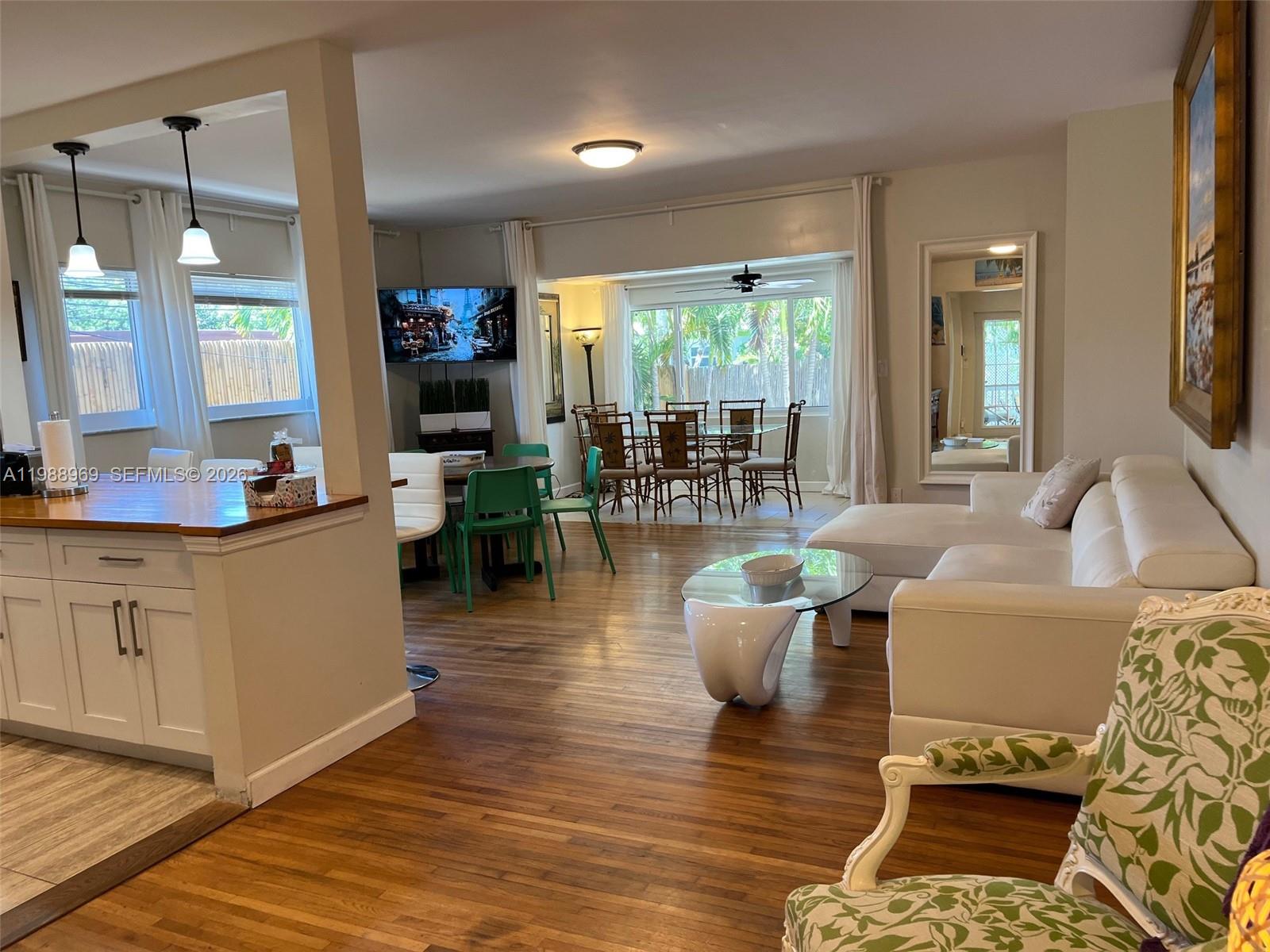 113 Southwest 2nd Street Hallandale Beach, FL 33009 - Photo 36 of 50 a living room with furniture and a wooden floor