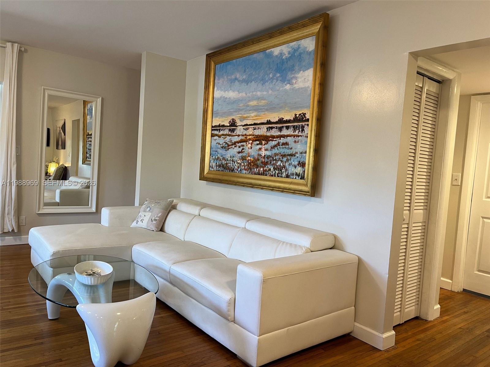 113 Southwest 2nd Street Hallandale Beach, FL 33009 - Photo 37 of 50 a living room with furniture and a large window