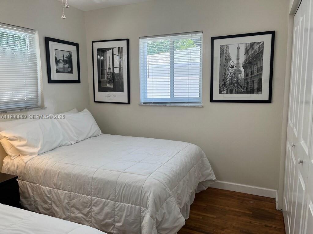 113 Southwest 2nd Street Hallandale Beach, FL 33009 - Photo 45 of 50 a bedroom with a bed and a window