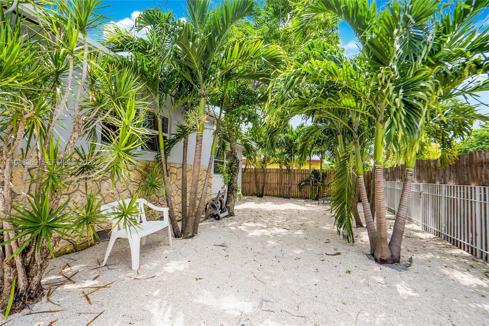 113 Southwest 2nd Street Hallandale Beach, FL 33009 - Photo 47 of 50 a view of a yard with plants and trees